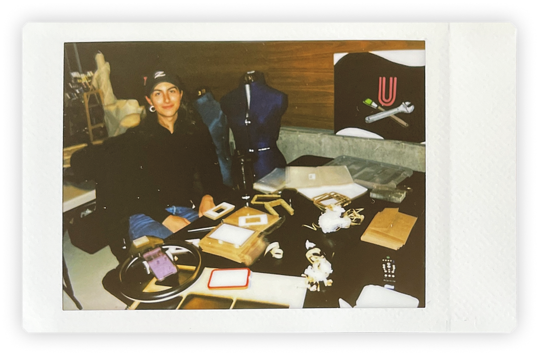 A woman sitting at her workshop desk 