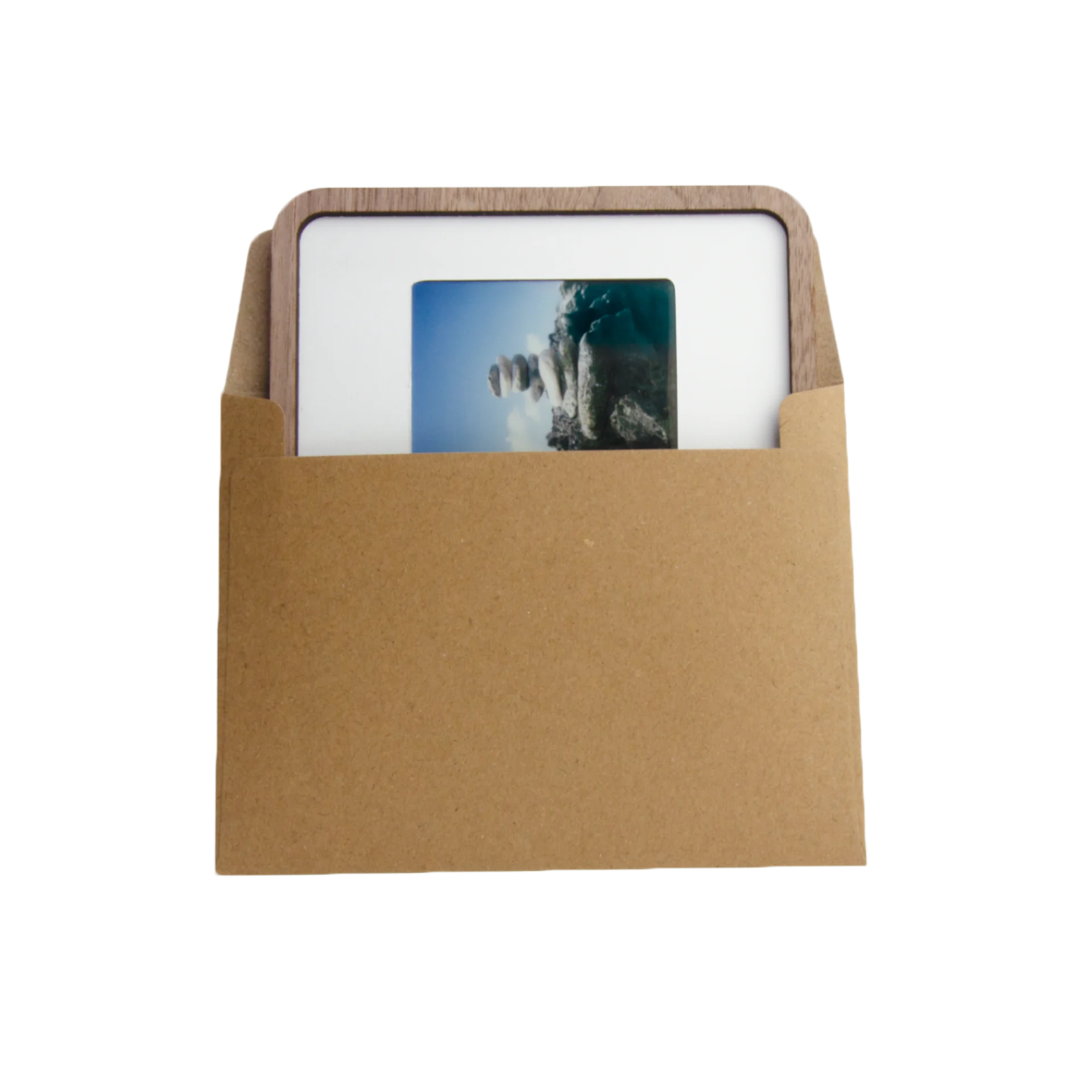 A Pop-up Frame with a photo sliding into its kraft paper envelope